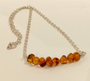 Silver chain with 8 amber beads