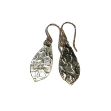 Load image into Gallery viewer, Pair of silver leaf-shaped earrings on a white background