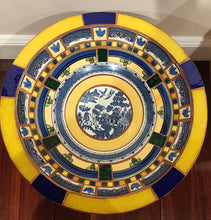 Load image into Gallery viewer, Overhead view of mosaic bird bath featuring vintage blue and white Willow pattern crockery with yellow, cobalt blue and green detailing.