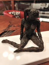 Load image into Gallery viewer, Original mixed media sculpture titled The Responder, showing a seated figure on a white base with a dark textured finish.