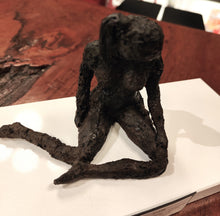 Load image into Gallery viewer, Original mixed media sculpture titled The Responder, showing a seated figure on a white base with a dark textured finish.